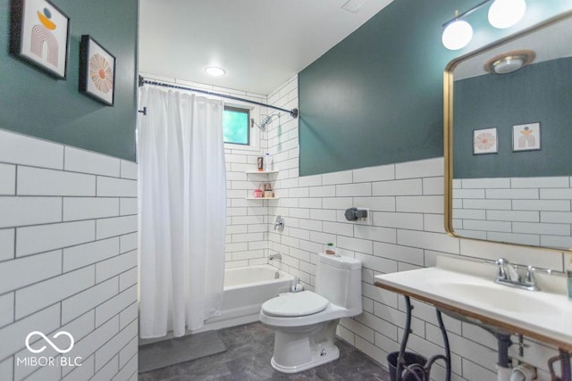 5078 Evergreen Ln, Gosport, IN 47433 - bathroom featuring tile walls, toilet, shower / bath combo, and a wainscoted wall