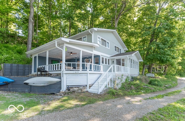 5078 Evergreen Ln, Gosport, IN 47433 - view of front of home featuring a sunroom, ceiling fan, stairs, and a wooden deck