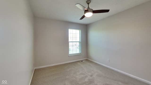12878 Ari Ln, Fishers, IN 46037 - spare room with baseboards, light carpet, and a ceiling fan