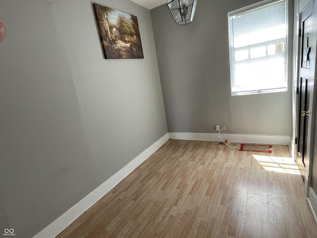 1164 Groff Ave, Indianapolis, IN 46222 - empty room with healthy amount of natural light, baseboards, and wood finished floors