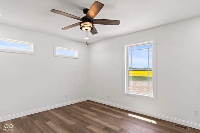 5003 W 900 N, Dupont, IN 47231 - spare room with dark wood-style flooring, baseboards, and a ceiling fan