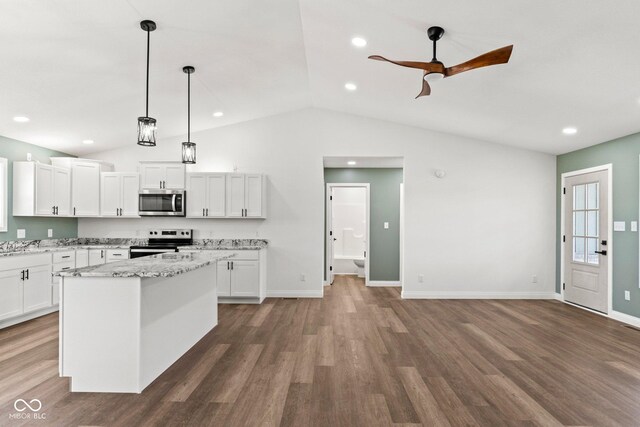 5003 W 900 N, Dupont, IN 47231 - kitchen with appliances with stainless steel finishes, wood finished floors, lofted ceiling, white cabinetry, and ceiling fan