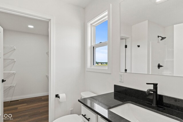 5003 W 900 N, Dupont, IN 47231 - full bath with wood finished floors, vanity, toilet, a shower, and baseboards