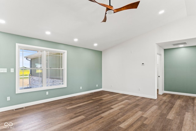 5003 W 900 N, Dupont, IN 47231 - spare room featuring wood finished floors, baseboards, recessed lighting, and lofted ceiling