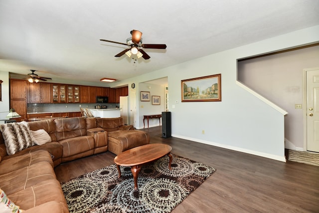 938 Weeping Way Ln, Avon, IN 46123 - living room featuring a ceiling fan, dark wood-type flooring, and baseboards