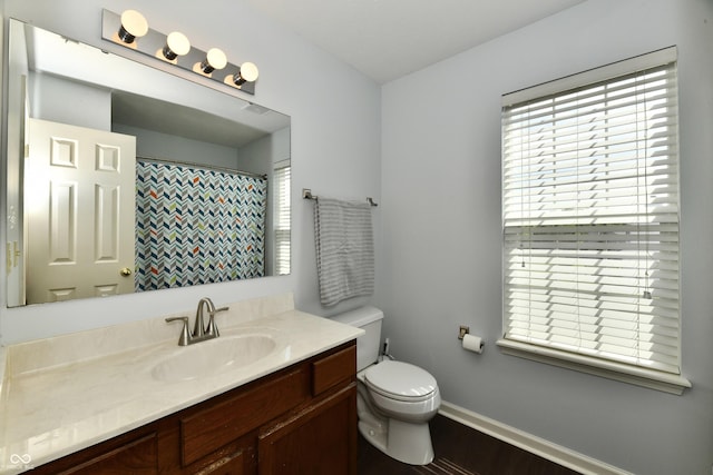 938 Weeping Way Ln, Avon, IN 46123 - bathroom with toilet, vanity, baseboards, wood finished floors, and a shower with curtain