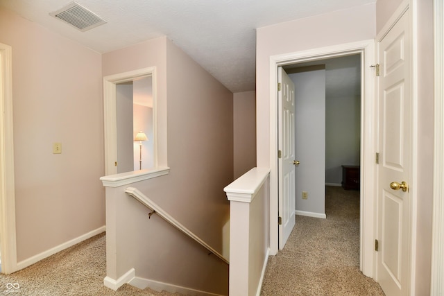938 Weeping Way Ln, Avon, IN 46123 - corridor with an upstairs landing, light colored carpet, and baseboards