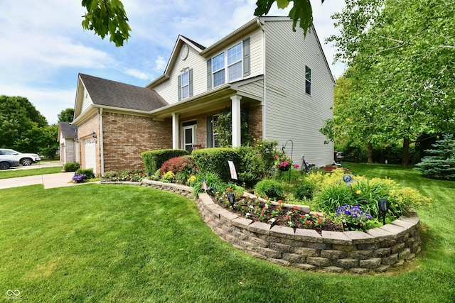 938 Weeping Way Ln, Avon, IN 46123 - view of front of home featuring brick siding, a front yard, concrete driveway, and an attached garage