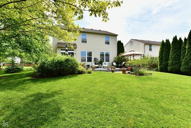 938 Weeping Way Ln, Avon, IN 46123 - rear view of house with a gazebo, a patio area, a lawn, and an outdoor living space
