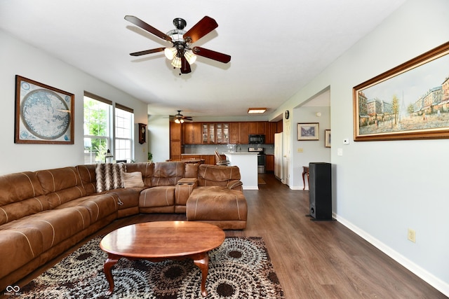 938 Weeping Way Ln, Avon, IN 46123 - living area with a ceiling fan, dark wood-style flooring, and baseboards