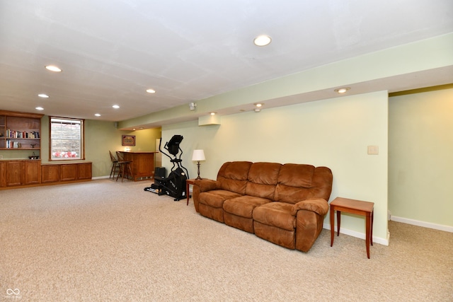 938 Weeping Way Ln, Avon, IN 46123 - living room featuring light carpet, recessed lighting, baseboards, and bar