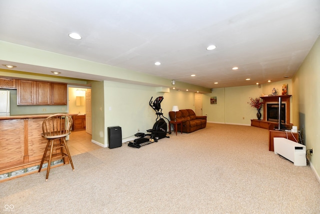 938 Weeping Way Ln, Avon, IN 46123 - exercise area featuring light colored carpet, recessed lighting, bar area, baseboards, and a glass covered fireplace