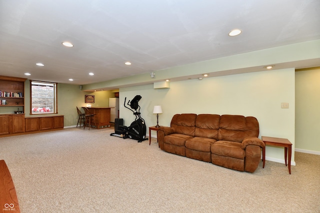938 Weeping Way Ln, Avon, IN 46123 - living room featuring recessed lighting, light carpet, a dry bar, and baseboards
