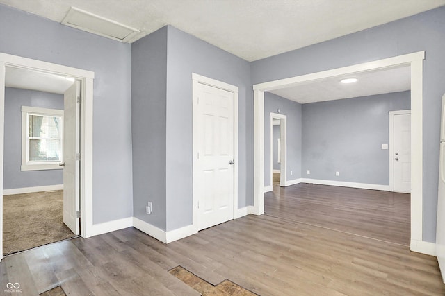 3109 E St Joseph St, Indianapolis, IN 46201 - unfurnished room with attic access, wood finished floors, and baseboards