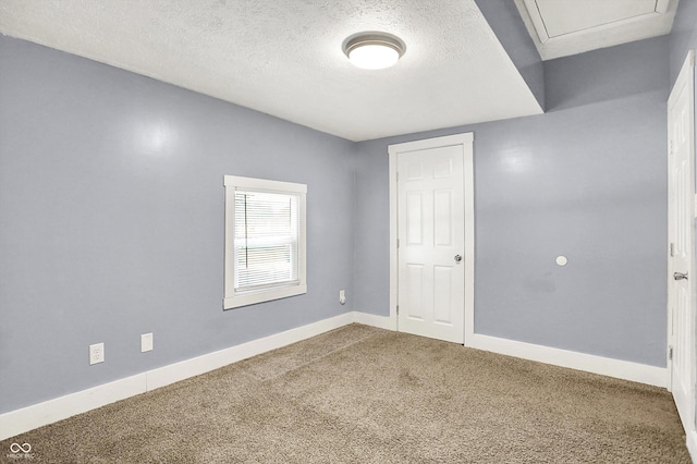 3109 E St Joseph St, Indianapolis, IN 46201 - spare room featuring carpet flooring, a textured ceiling, and baseboards