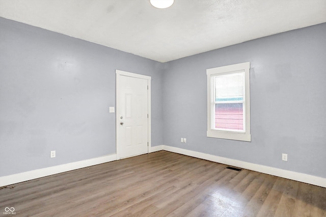 3109 E St Joseph St, Indianapolis, IN 46201 - unfurnished room featuring baseboards and wood finished floors