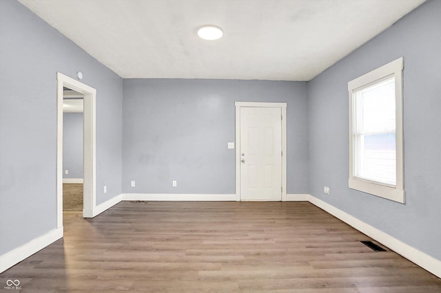 3109 E St Joseph St, Indianapolis, IN 46201 - spare room featuring wood finished floors and baseboards