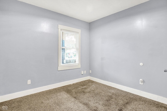 3109 E St Joseph St, Indianapolis, IN 46201 - unfurnished room featuring baseboards and carpet floors