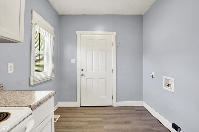 3109 E St Joseph St, Indianapolis, IN 46201 - washroom featuring cabinet space, light wood-style floors, washer hookup, and baseboards