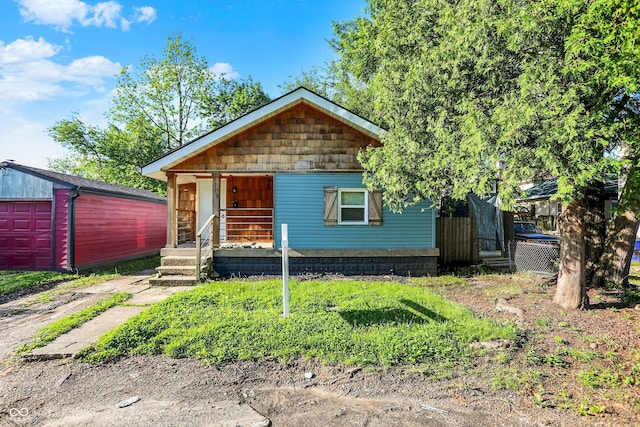 3109 E St Joseph St, Indianapolis, IN 46201 - view of front facade featuring an outdoor structure and a porch