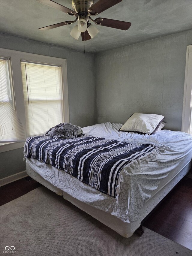 1168 N Gladstone Ave, Indianapolis, IN 46201 - bedroom with wood finished floors and ceiling fan