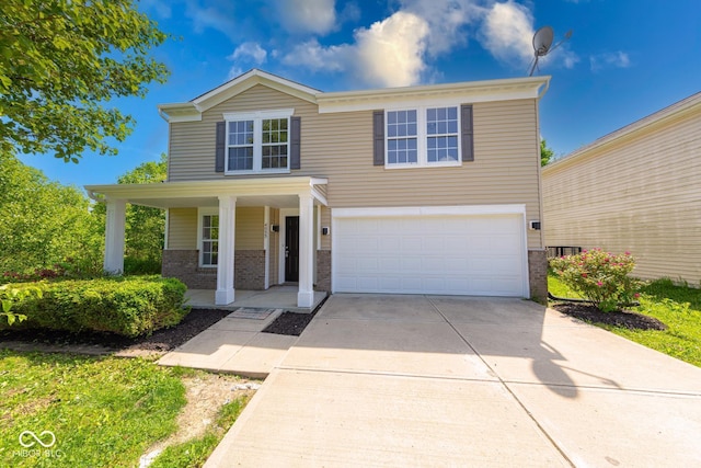 4055 Steelewater Way, Indianapolis, IN 46235 - traditional-style house featuring brick siding, an attached garage, a porch, and concrete driveway