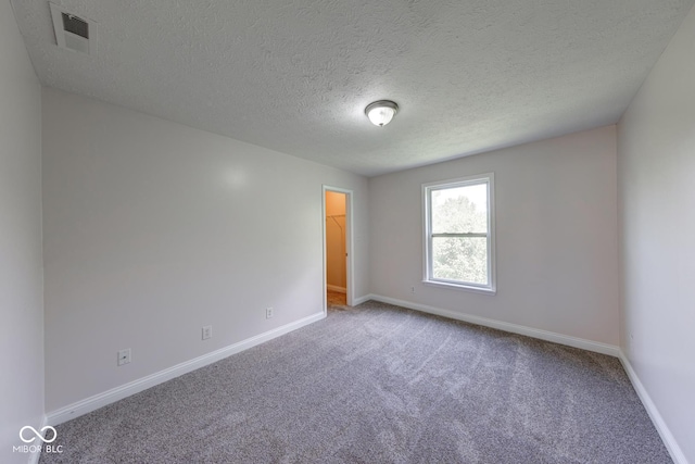 4055 Steelewater Way, Indianapolis, IN 46235 - carpeted empty room featuring baseboards and a textured ceiling