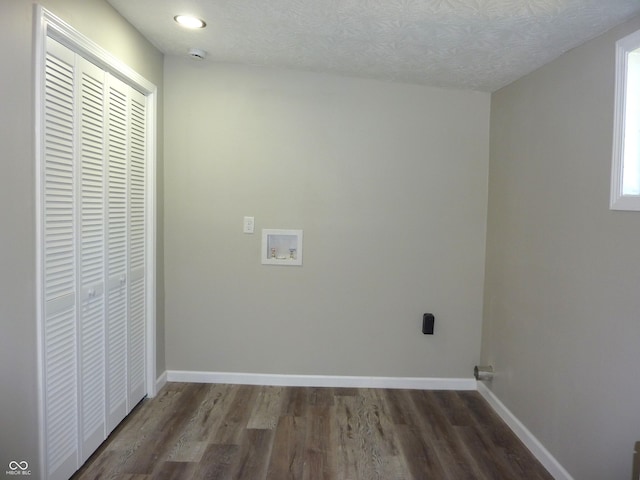 2007 Park Ave, Anderson, IN 46016 - clothes washing area featuring washer hookup, wood finished floors, baseboards, and a textured ceiling