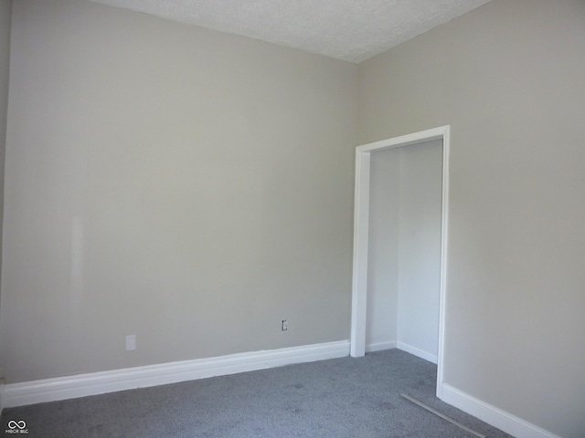 2007 Park Ave, Anderson, IN 46016 - unfurnished room with dark colored carpet and baseboards