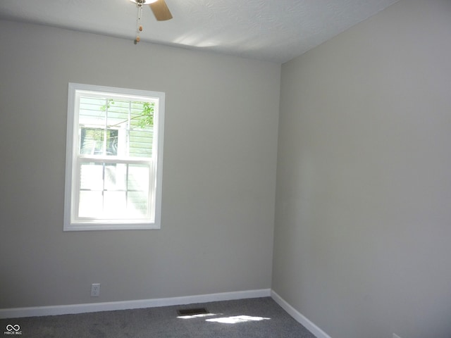 2007 Park Ave, Anderson, IN 46016 - carpeted spare room with baseboards and a ceiling fan
