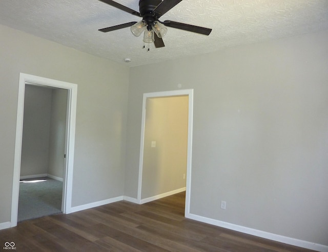 2007 Park Ave, Anderson, IN 46016 - unfurnished room with wood finished floors, a textured ceiling, a ceiling fan, and baseboards