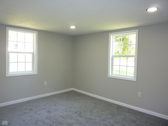 2007 Park Ave, Anderson, IN 46016 - carpeted empty room with baseboards and recessed lighting