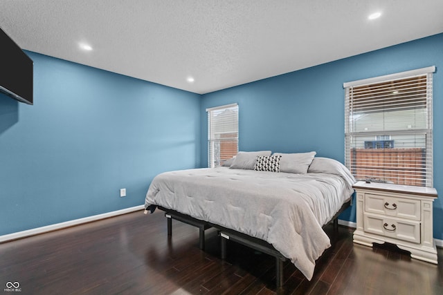 805 Sunvista Dr, Avon, IN 46123 - bedroom featuring baseboards, dark wood-style flooring, and a textured ceiling