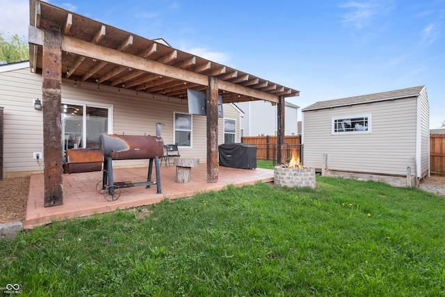 805 Sunvista Dr, Avon, IN 46123 - back of property featuring a fire pit, oil tank, a patio, and an outdoor structure