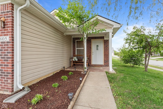 805 Sunvista Dr, Avon, IN 46123 - doorway to property with brick siding and a lawn