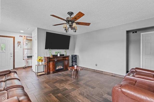 805 Sunvista Dr, Avon, IN 46123 - living room featuring baseboards, a ceiling fan, and a textured ceiling