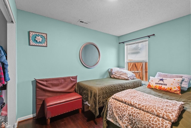 805 Sunvista Dr, Avon, IN 46123 - bedroom featuring wood finished floors and a textured ceiling