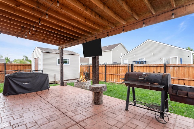 805 Sunvista Dr, Avon, IN 46123 - fenced backyard with an outdoor fire pit, an outdoor structure, a patio area, and area for grilling