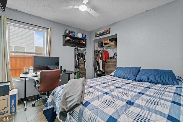 805 Sunvista Dr, Avon, IN 46123 - bedroom with a closet, a textured ceiling, an office area, a ceiling fan, and a spacious closet