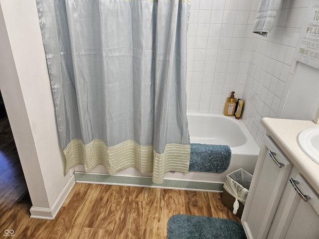 4962 Potomac Square Pl, Indianapolis, IN 46268 - bathroom with wood finished floors, shower / bathtub combination with curtain, baseboards, and vanity