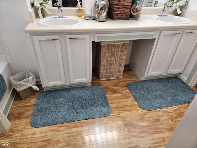 4962 Potomac Square Pl, Indianapolis, IN 46268 - bathroom with double vanity and wood finished floors