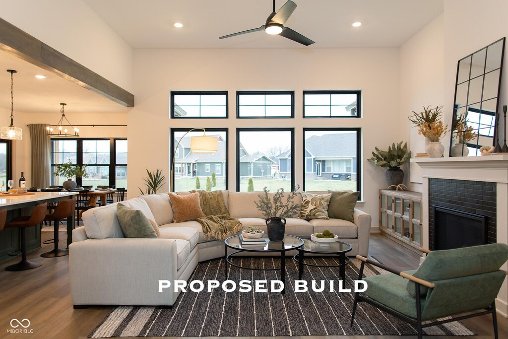 LOT2 Vanderbilt Dr, Anderson, IN 46011 - living room with wood finished floors, recessed lighting, a fireplace, ceiling fan, and a towering ceiling