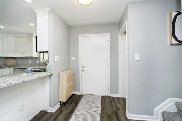 3852 Knollton Rd Unit 3852, Indianapolis, IN 46228 - doorway with dark wood-style flooring, a sink, baseboards, and recessed lighting
