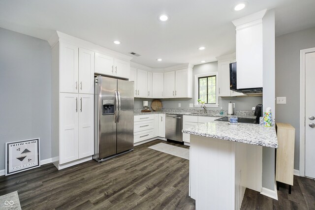 3852 Knollton Rd Unit 3852, Indianapolis, IN 46228 - kitchen featuring stainless steel appliances, a peninsula, a sink, white cabinets, and dark wood-style floors
