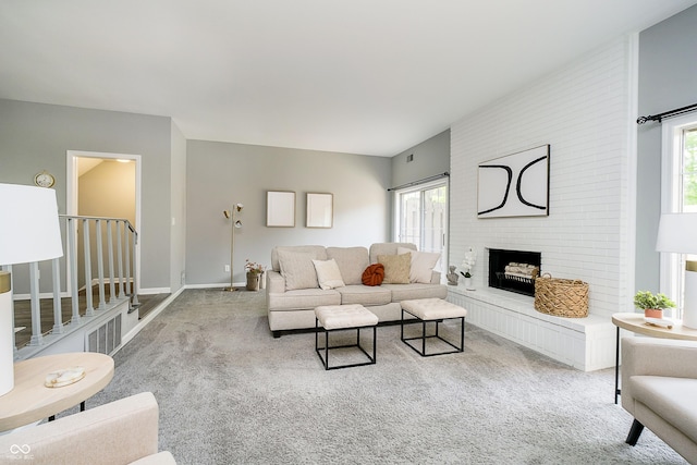 3852 Knollton Rd Unit 3852, Indianapolis, IN 46228 - living room with carpet, a brick fireplace, and baseboards