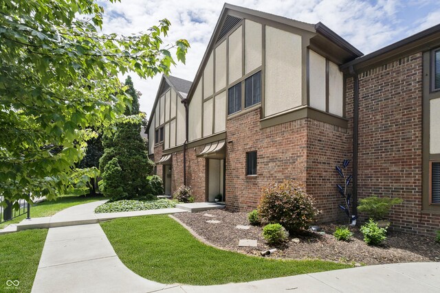 3852 Knollton Rd Unit 3852, Indianapolis, IN 46228 - view of side of home with brick siding and stucco siding