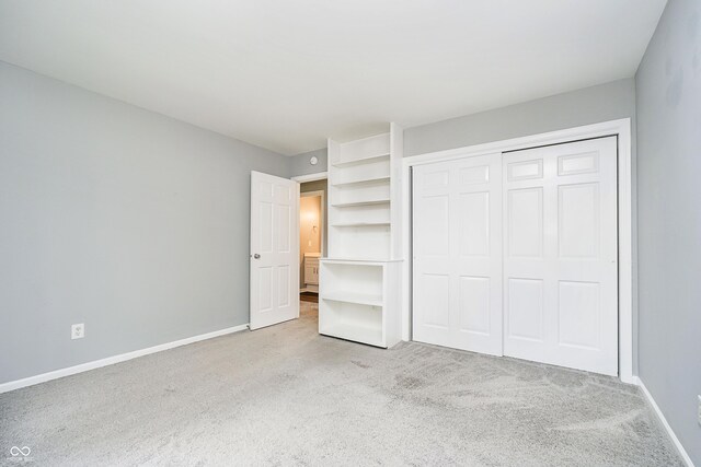 3852 Knollton Rd Unit 3852, Indianapolis, IN 46228 - unfurnished bedroom with light colored carpet, baseboards, and a closet