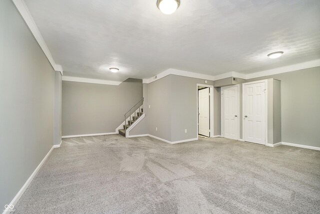 3852 Knollton Rd Unit 3852, Indianapolis, IN 46228 - finished basement featuring carpet, baseboards, stairs, and ornamental molding