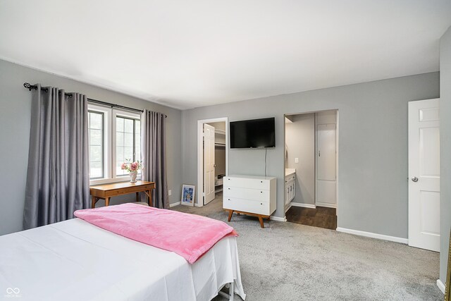 3852 Knollton Rd Unit 3852, Indianapolis, IN 46228 - carpeted bedroom featuring baseboards, a walk in closet, and a closet