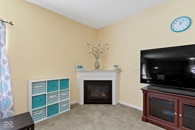 5145 Greenside Dr, Indianapolis, IN 46235 - living room with carpet flooring, a glass covered fireplace, and baseboards